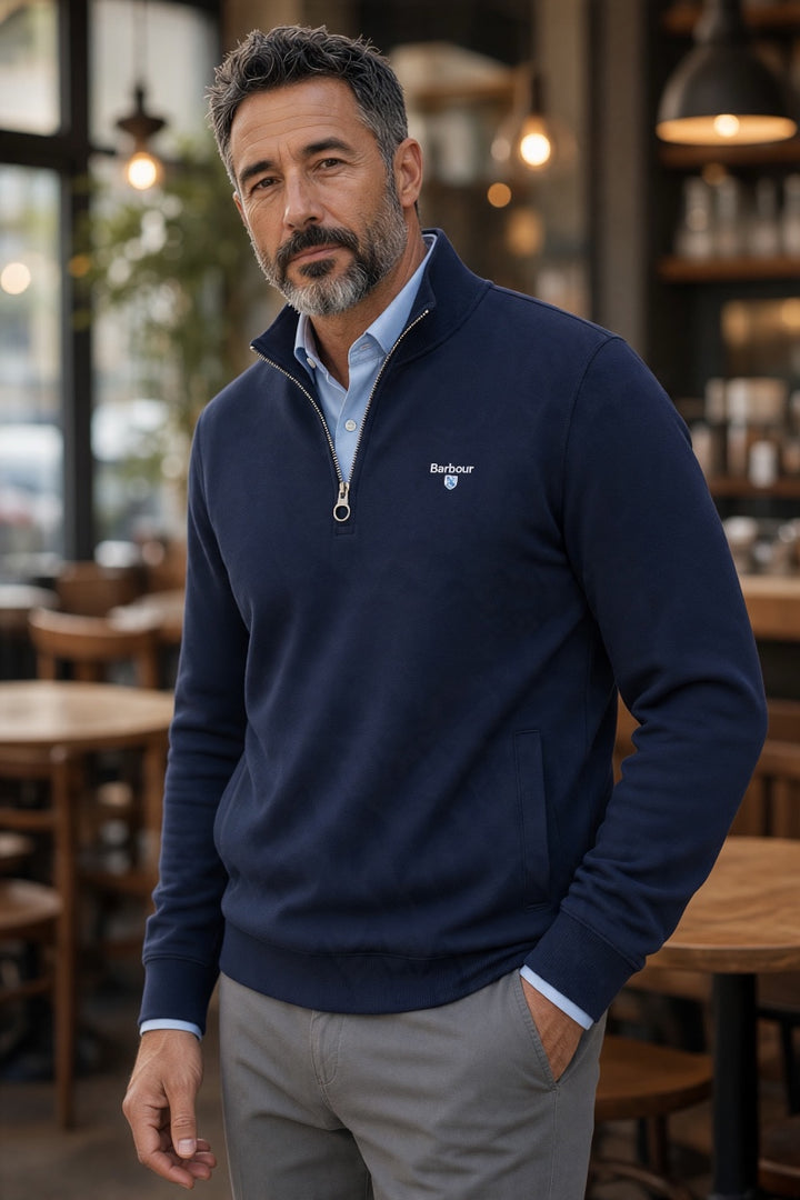 Navy Barbour half-zip sweatshirt on model, long sleeves, chest logo