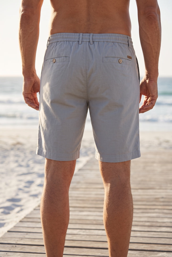Grey linen-mix shorts, back view with elastic waistband and button pockets
