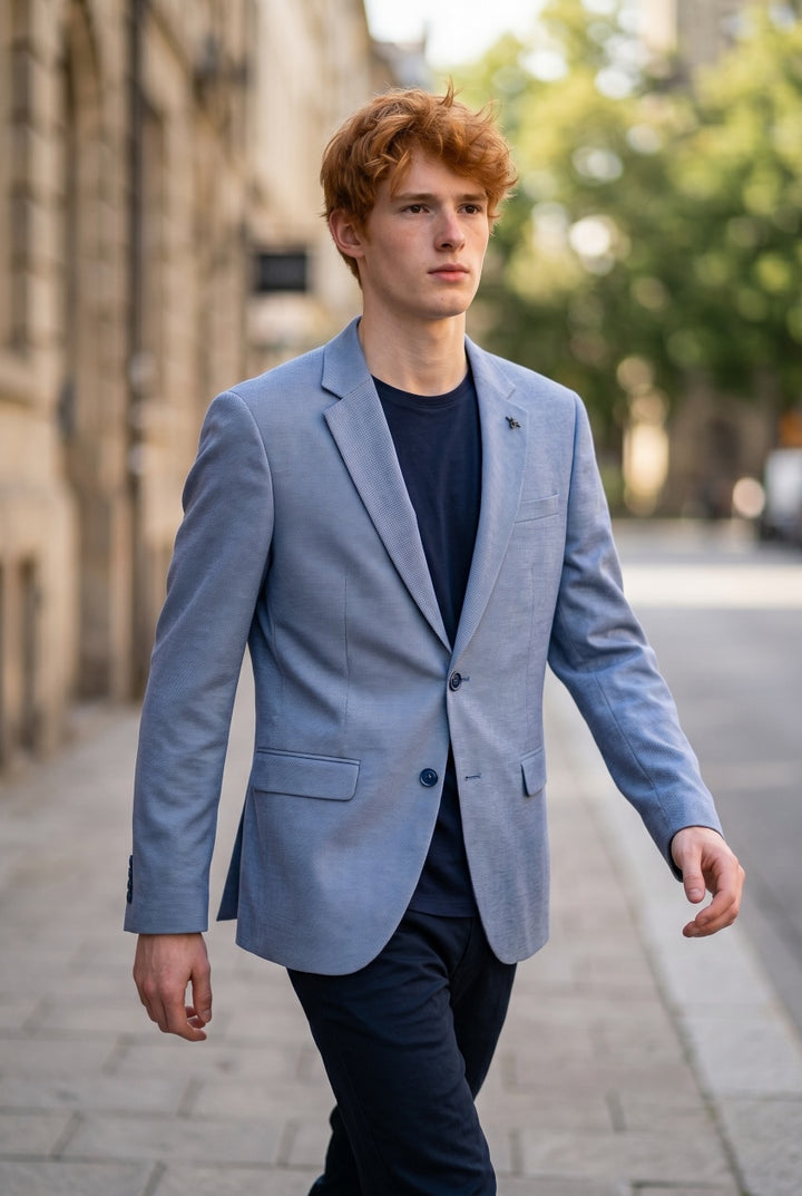 Light blue single-breasted blazer with notch lapels and front button closure
