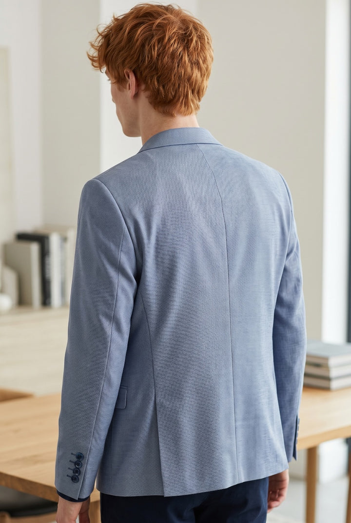 Light blue blazer back view with notched collar and rear vent