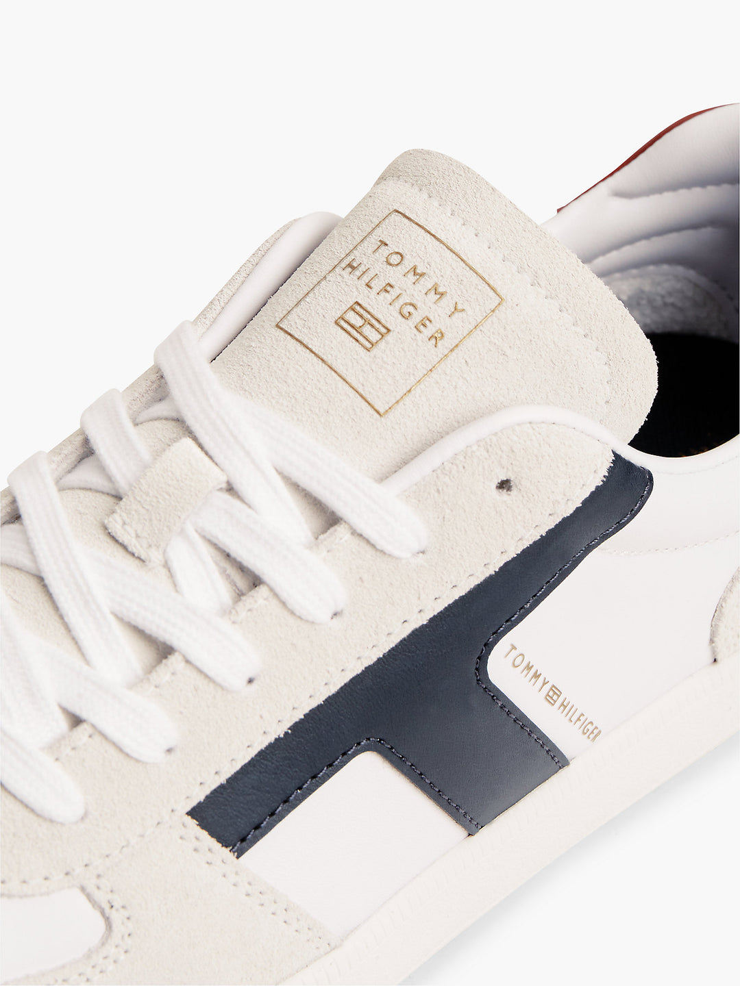 White sneaker upper with TOMMY HILFIGER logo patch and lace detail
