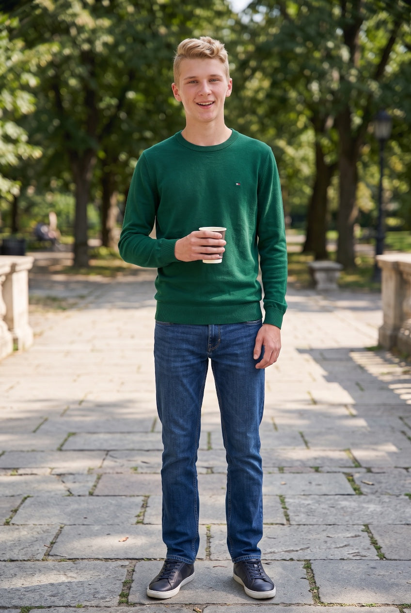 TOMMY HILFIGER green crew neck sweater worn with blue jeans