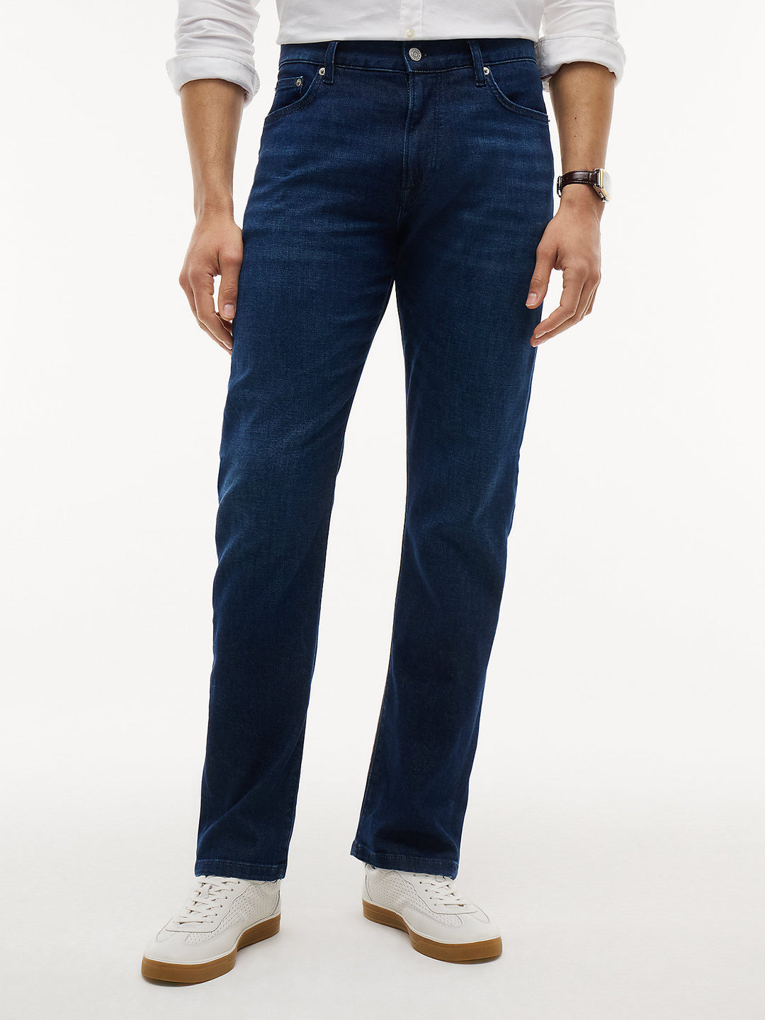 Dark blue slim-straight jeans with five-pocket design and button waist