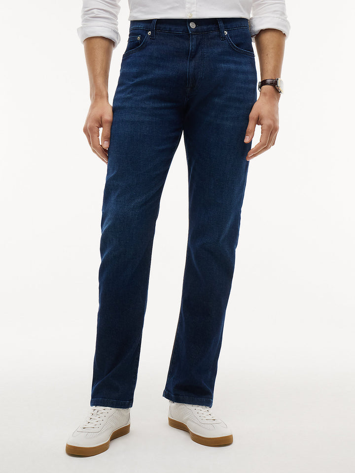 Dark blue slim-straight jeans with five-pocket design and button waist