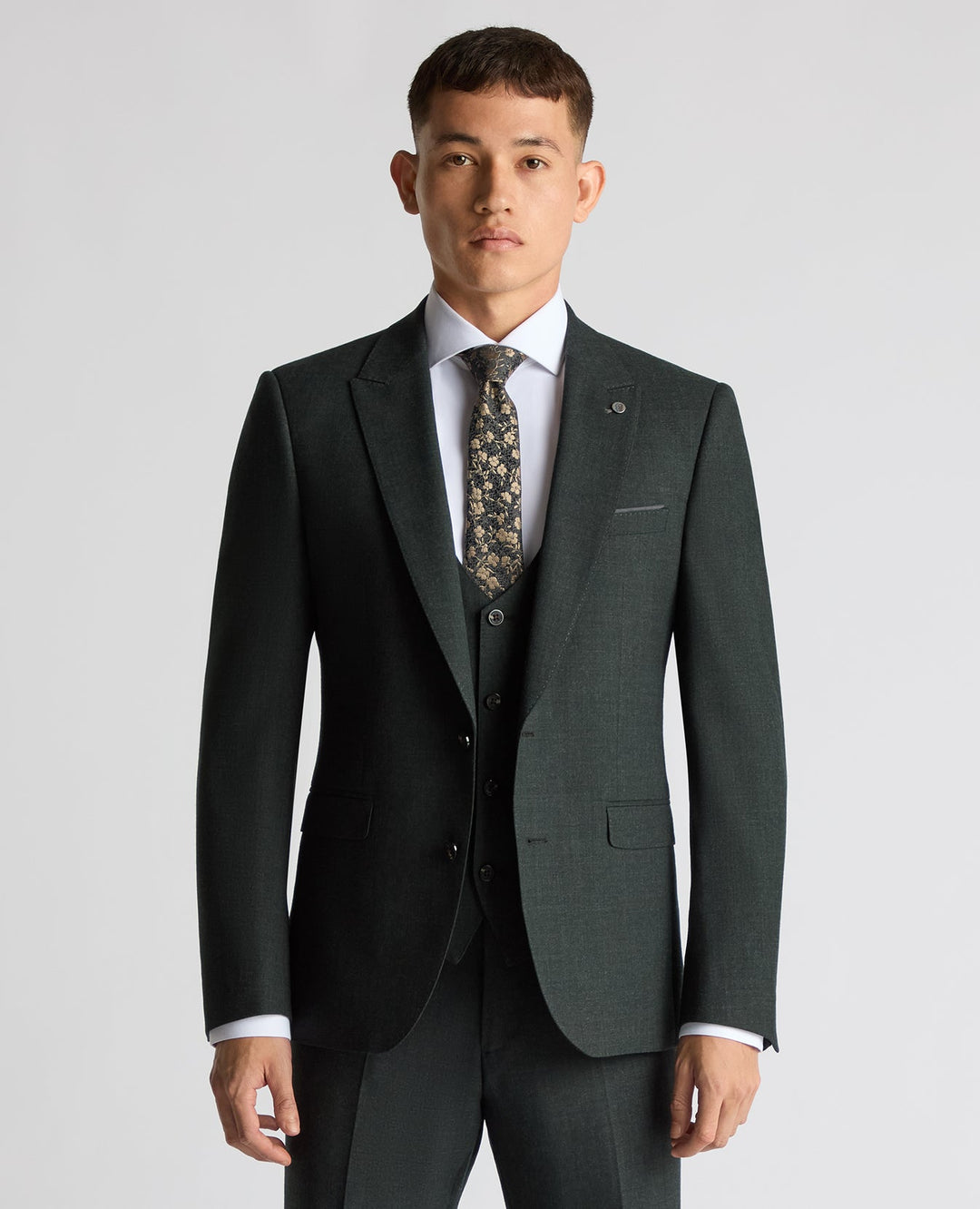 Dark green suit jacket with two-button front, notch lapels, and breast pocket