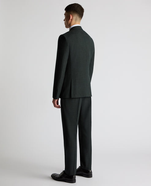 Dark green suit jacket back view with center seam and notched collar