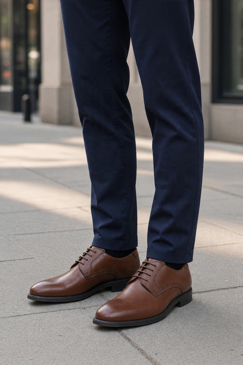 Brown leather lace-up derby shoes with stitched toe and low profile sole