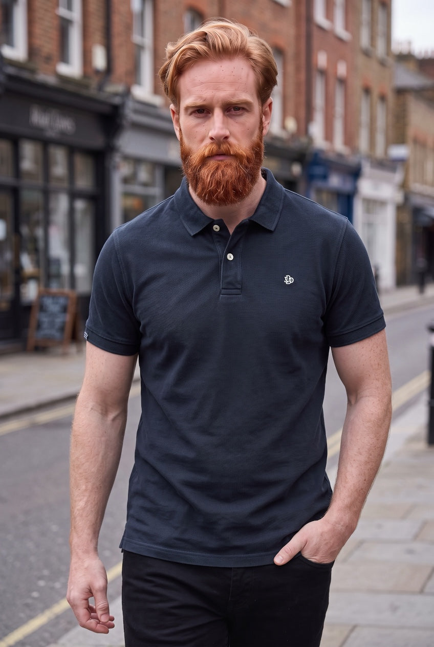 Navy short-sleeve polo shirt with button placket and small chest logo