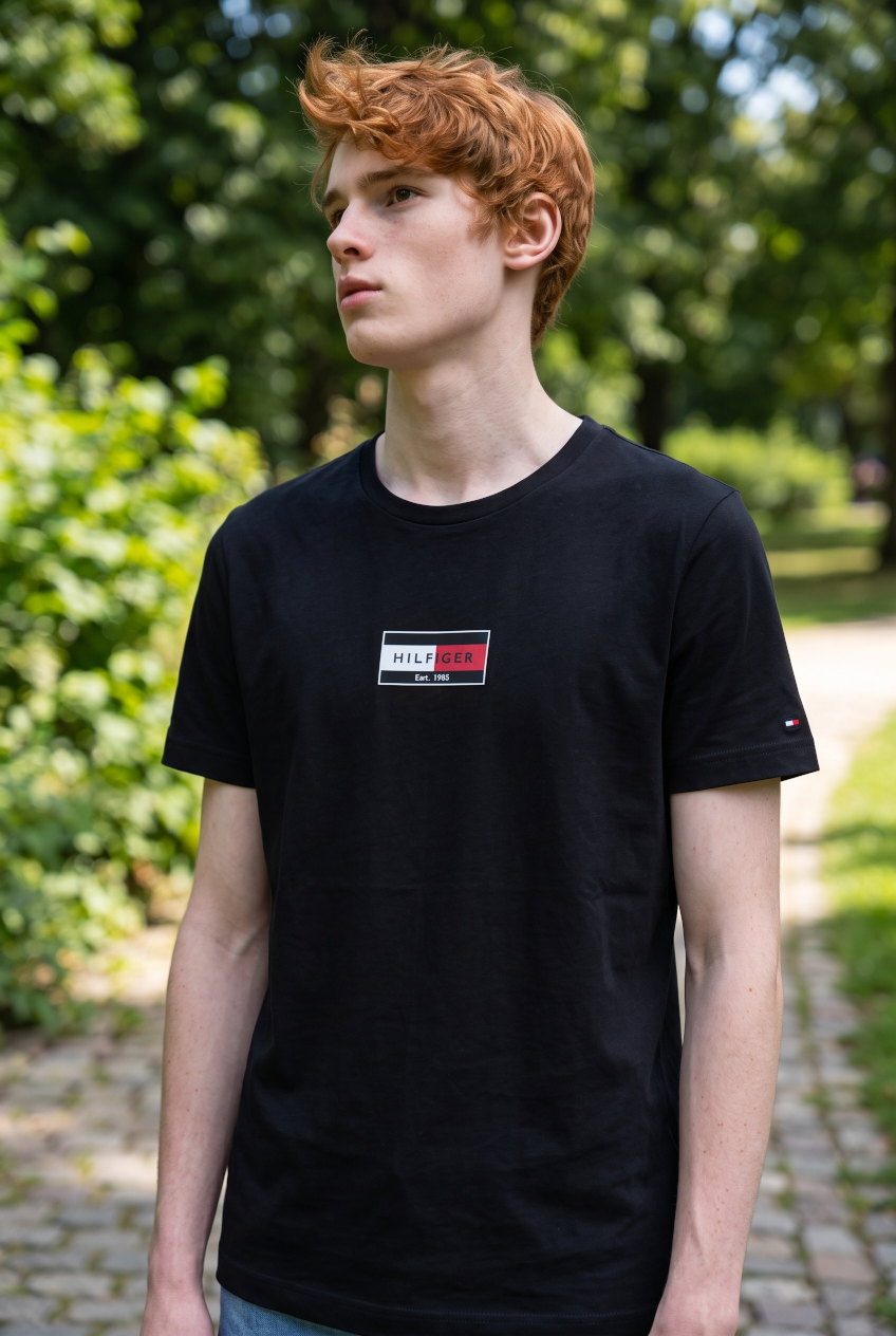 Men's dark navy short-sleeve flag logo T-shirt, worn by model