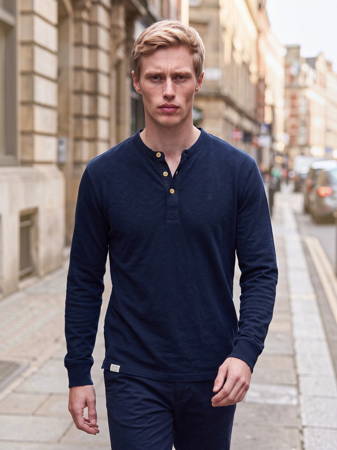 Navy grandad top on model, long sleeves with three-button placket