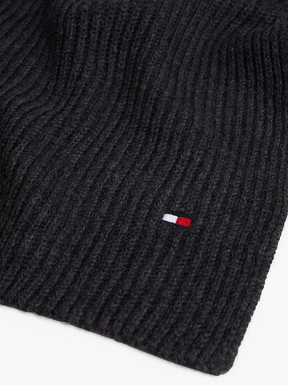Dark ribbed knit scarf with small red-white-blue flag logo patch