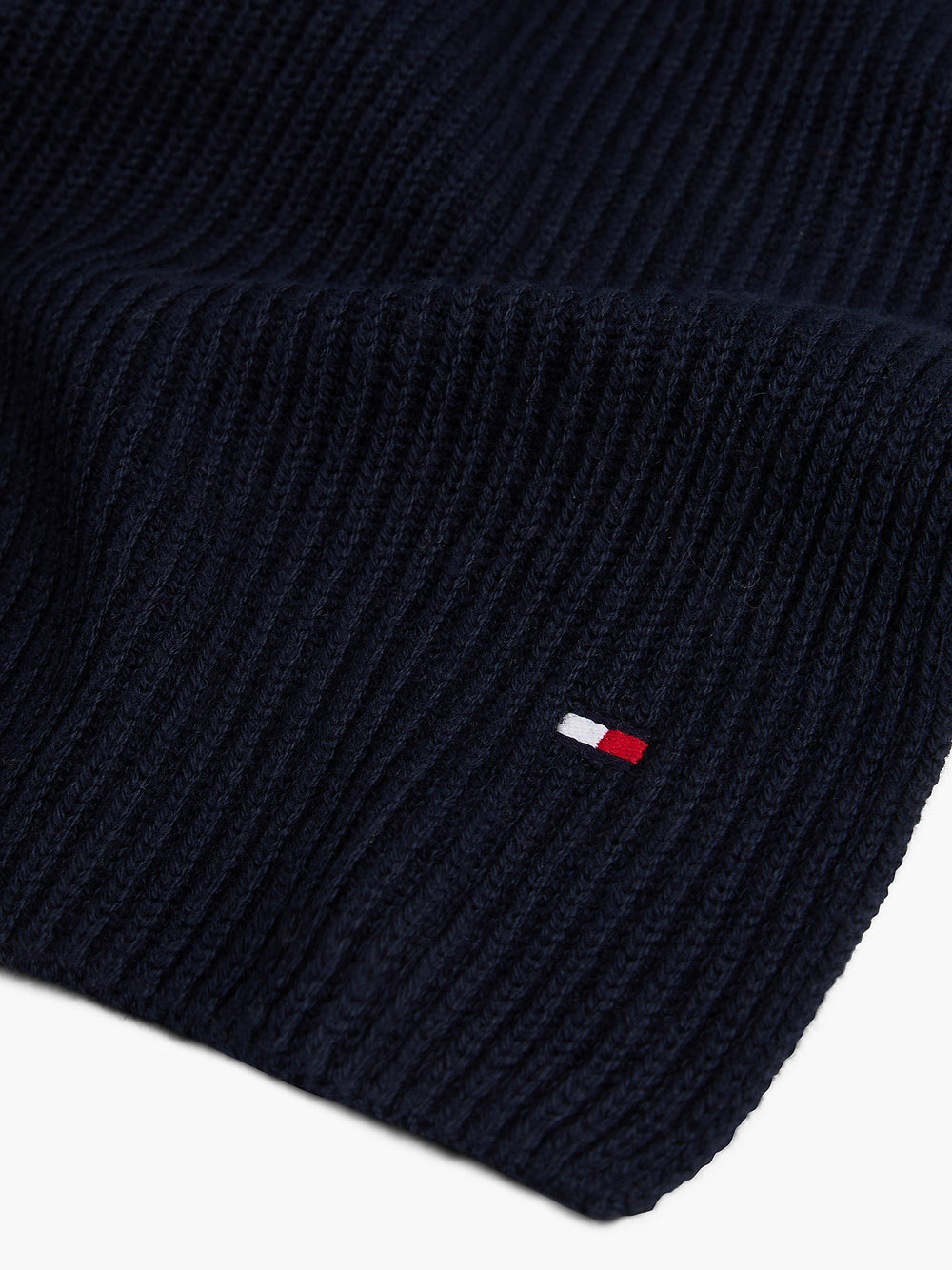 Navy ribbed knit scarf corner with small multicolor flag logo