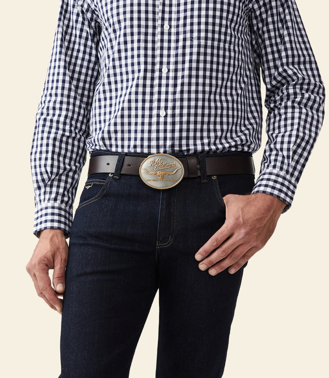 R.M. Williams logo buckle on dark belt, worn with dark jeans