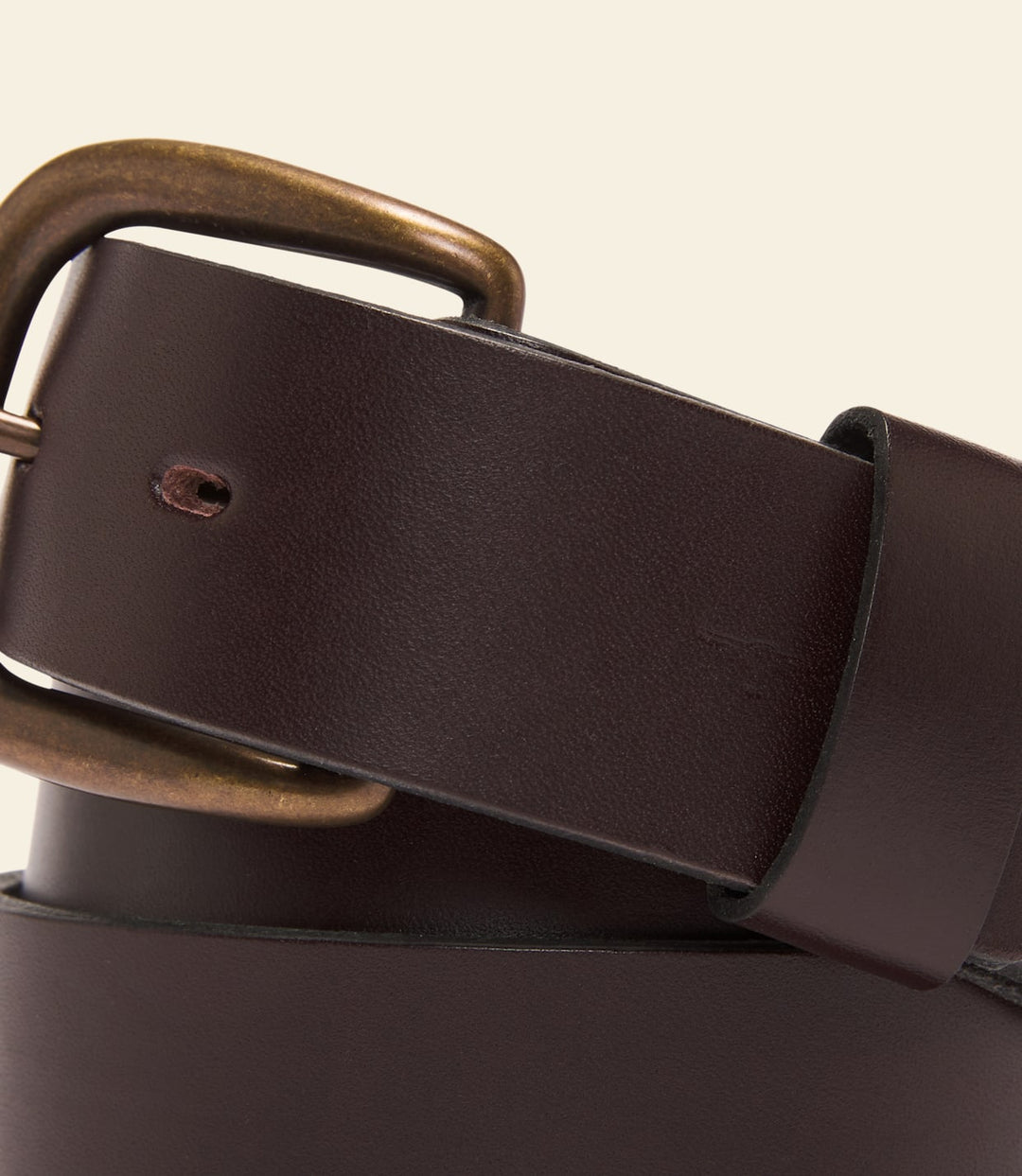 Brown leather belt with rectangular keeper and antique bronze buckle.