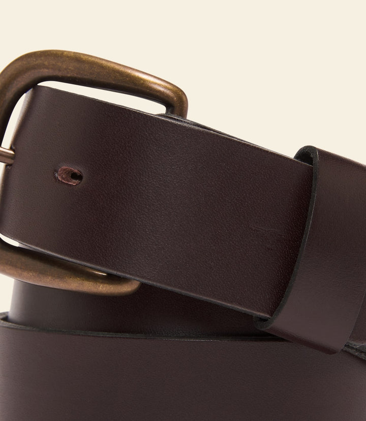 Brown leather belt with rectangular keeper and antique bronze buckle.