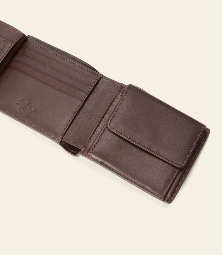 Chestnut leather bifold wallet interior with multiple card pockets and fold seam