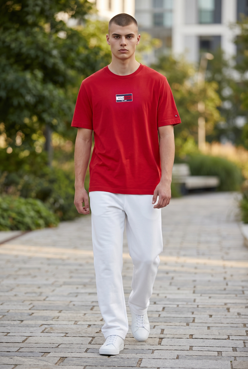 Red short-sleeve T-shirt with small flag logo on chest
