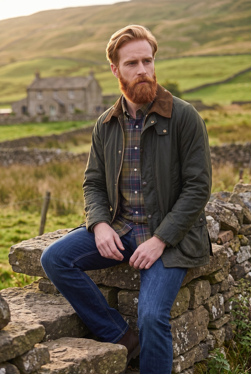 Dark olive wax jacket with brown cord collar and snap details, worn open at front