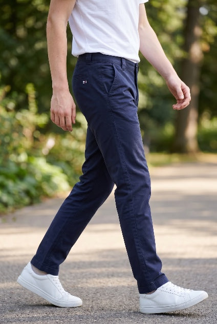 TOMMY JEANS navy Scanton chinos, front side view, cuffed hems and zip fly