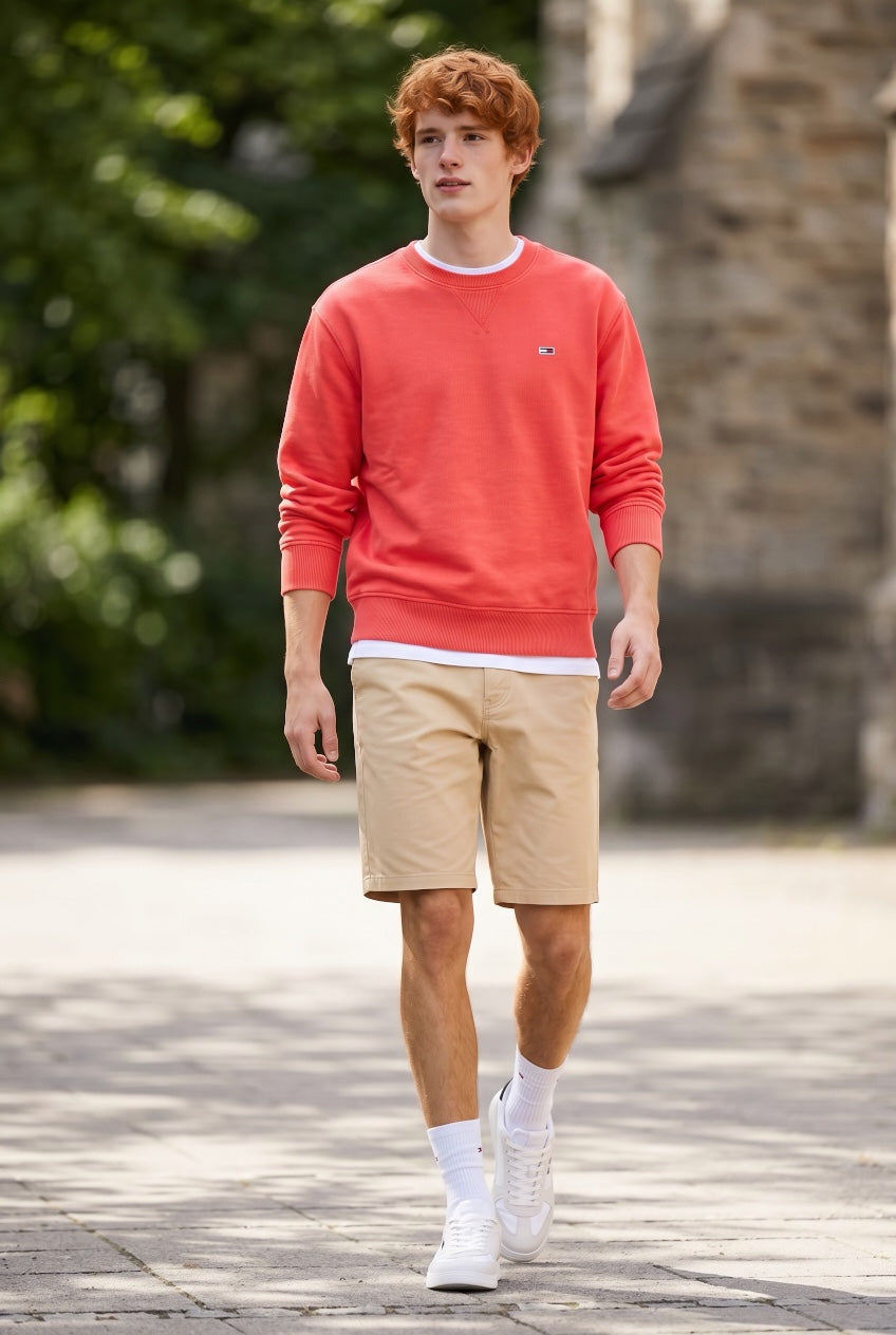 Beige/tan mid-thigh shorts with front pockets and cuffed hem
