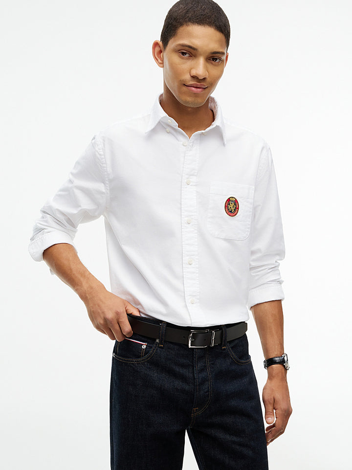 Black reversible leather belt with silver buckle worn with dark jeans