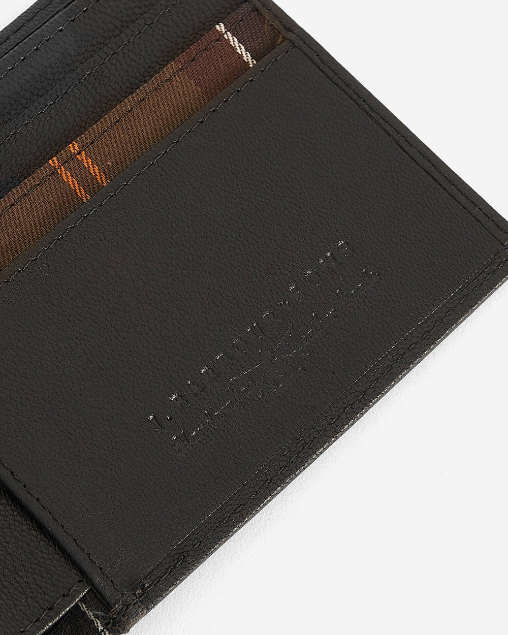 Black leather card holder with embossed logo and contrast stitching