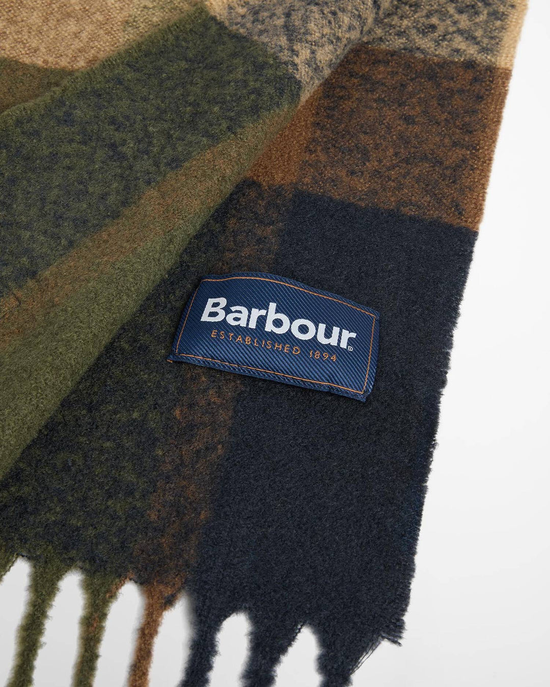 Dark tartan scarf with Barbour patch and short fringed hem