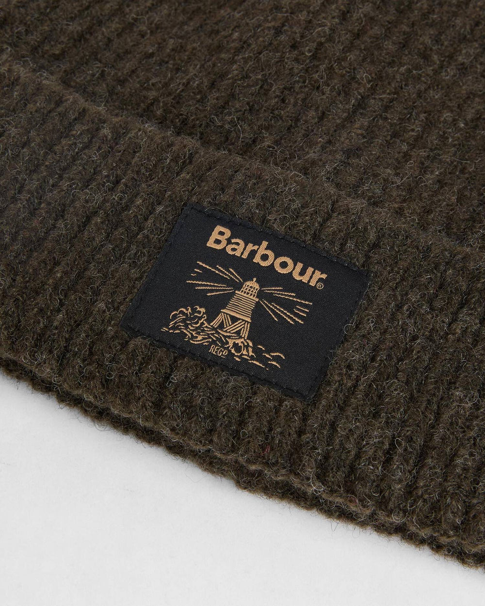 Fringed scarf with Barbour label on textured dark knit fabric