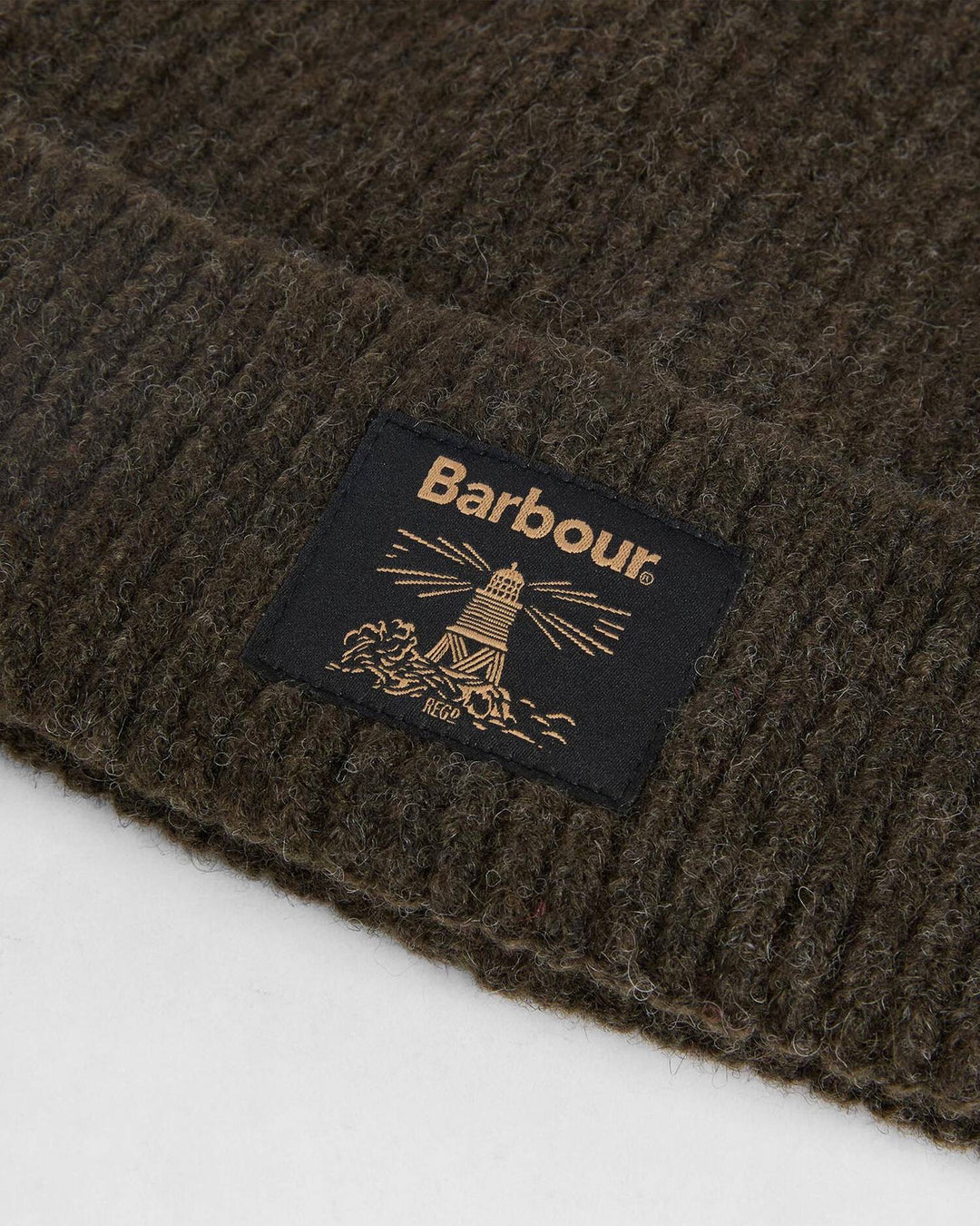 Fringed scarf with Barbour label on textured dark knit fabric