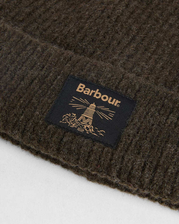 Fringed scarf with Barbour label on textured dark knit fabric