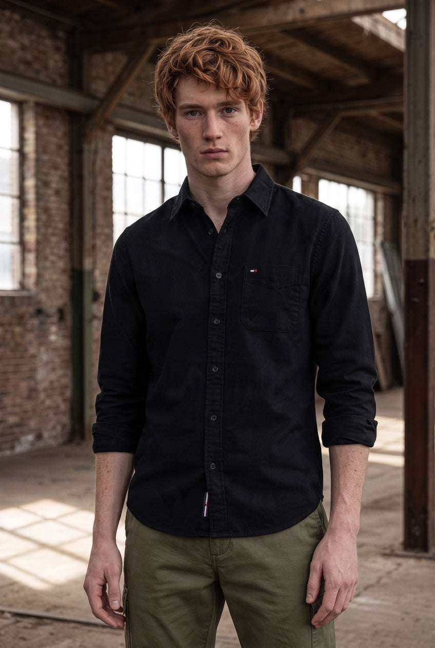 Tommy Jeans black baby corduroy shirt with button front, chest logo, and rolled sleeves